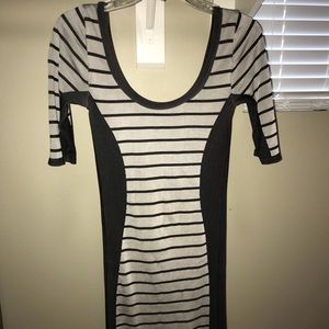 Body contouring grey striped dress.
